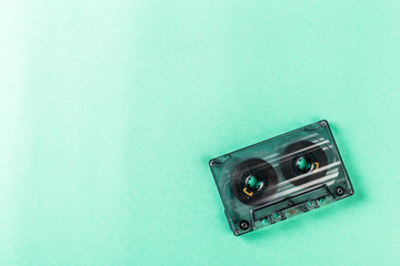 Old audio cassettes on turquoise background