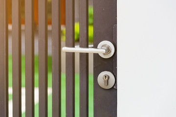 metallic door handle on metallic door