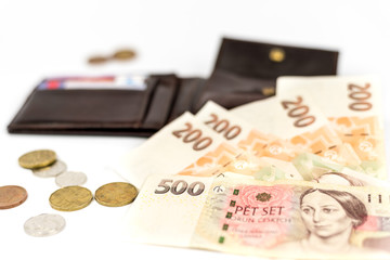 Czech money isolated on white background, banknotes, coins and open wallet with credit cards