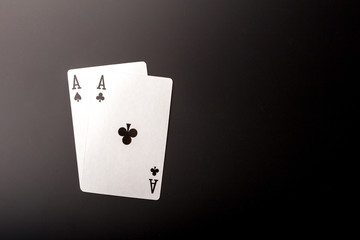 poker chips and cards on black background