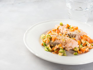 Steamed salmon with carrots and zucchini