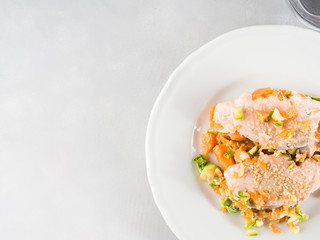 Steamed salmon with carrots. Copy space top view