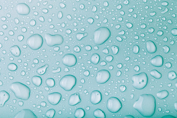 Drops of water on a color background. Blue. Toned