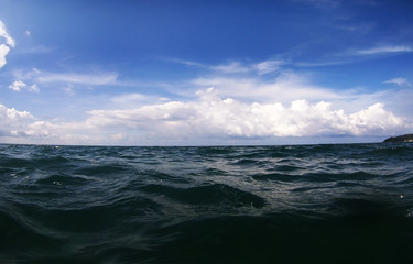 ocean wave splitted by waterline to underwater part
