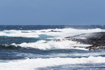 Lava coast and blue waters and white waves - Punalu'u Black Sand