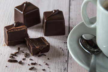 Chocolate candies and a cup of coffee