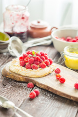 Homemade Paleo Gluten-free Dessert with Raspberries and Icing Sugar