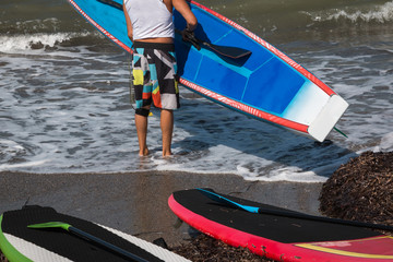 Man Put Board in Water in Shoreline