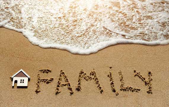 House and family on the sand beach - property investment concept