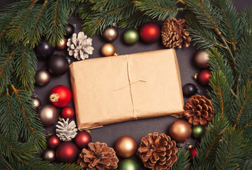 Christmas gift and baubles with pine branch