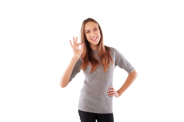 Fototapeta premium Female denoting approval with ok sign isolated over white backgr