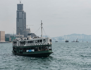Fototapeta premium Ferry puts on in the pier of Viktoria harbour Hong Kong