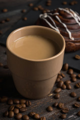 Cup of coffee on the rustic wooden background. Selective focus.