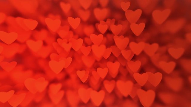 Valentine's Day card: a huge amount  of red hearts bokeh, slow motion