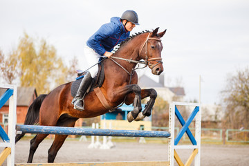 Young horseman on show jumping competition