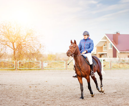 Sportsman riding horse on equestrian competition.