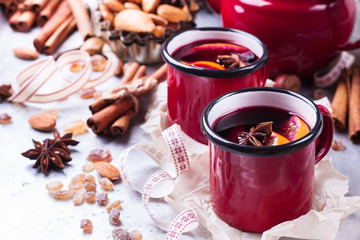 Hot mulled wine in a red mug for winter holidays