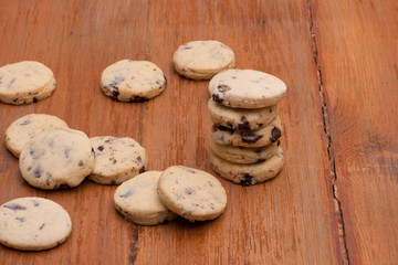 Oatmeal cookies with raisins on wooden old boards