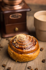 Fresh bun on the rustic wooden background. Selective focus.