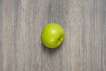 Apple on wooden table