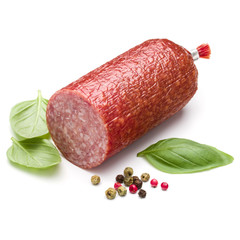 Salami smoked sausage, basil leaves and peppercorns isolated on