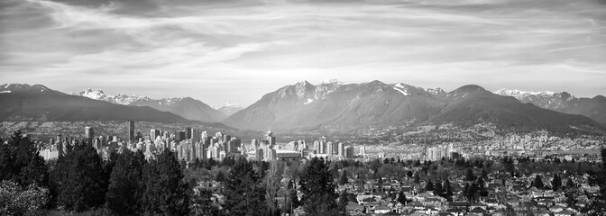 Monochrome Vancouver Cityscape with Surrounding Mountains