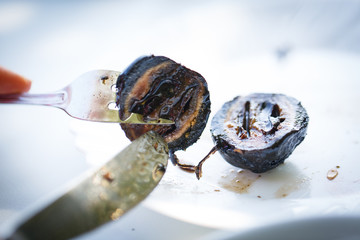 Grilled walnut on fork