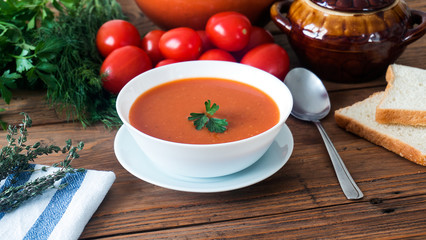 hot fresh homemade tomato soup with thyme, top view