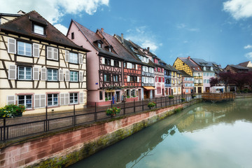 Colorful traditional french houses on the side of river Lauch in Colmar, France.