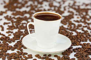 coffee in coffee cup with natural grains