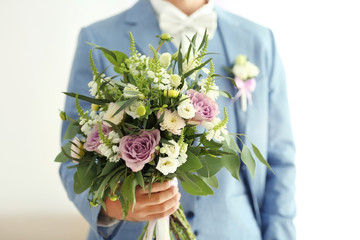 Groom with beautiful bouquet, closeup