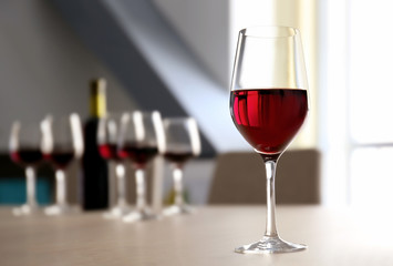 Glass of red wine on table in restaurant