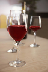 Glasses of red wine on table in restaurant