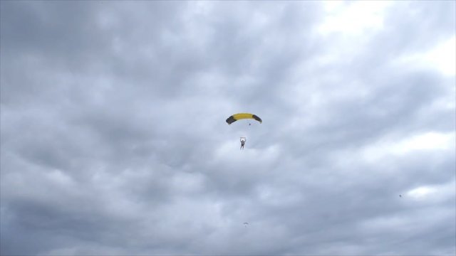 Pretty woman landing her parachute