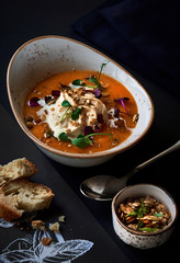 Pumpkin soup garnished with whipped cream