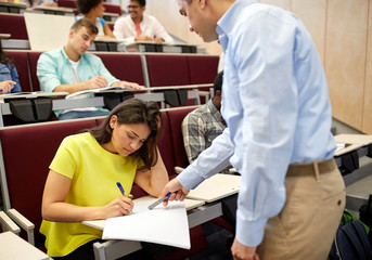 Obraz premium group of students and teacher with notebook