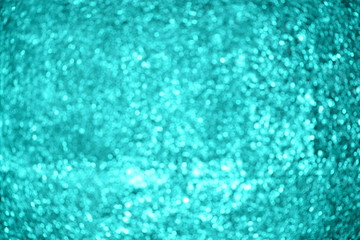 green background with shimmering glitter - Defocused lights