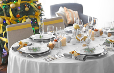 Table served for Christmas dinner in living room