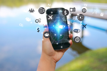 Hand holding smart phone. Social media concept,icons