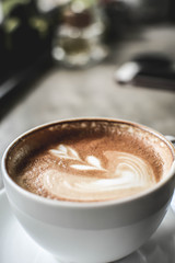 hot coffee latte art in coffee shop.selective