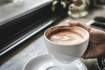 hot coffee latte art in coffee shop.selective