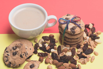 Cup of coffee with cookies and nuts