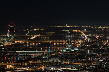 Vienna, aerial view at night with the river danube
