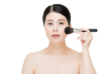 Close up of Smile woman with makeup brushes near face