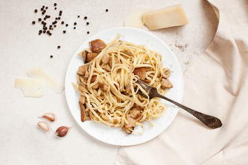 Cooked pasta with porcini on the white plate