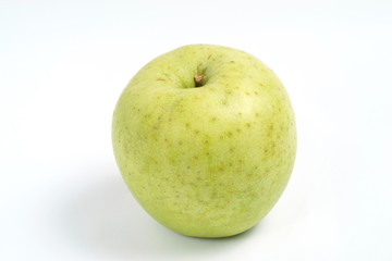 Close up of a green apple on wood background