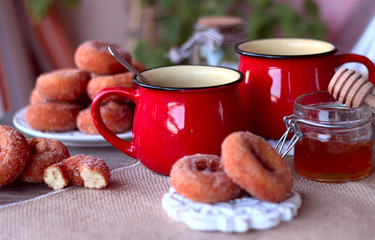 red cup tea wiht donuts