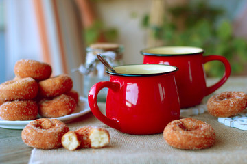 red cup tea wiht donuts