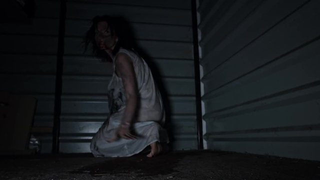 4k Horror Shot of a Dirty Zombie Woman Crawling at Camera
