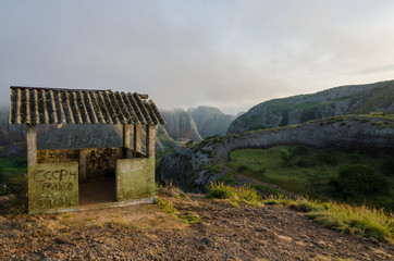 Fototapeta na wymiar Fog and concrete hut at Black Rocks of Pungo Andongo or Pedras Negras in Angola
